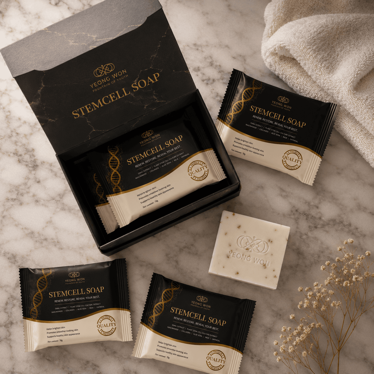 Open Yeong Won coffret with wrapped Stemcell Soap sachets and an unwrapped bar on marble